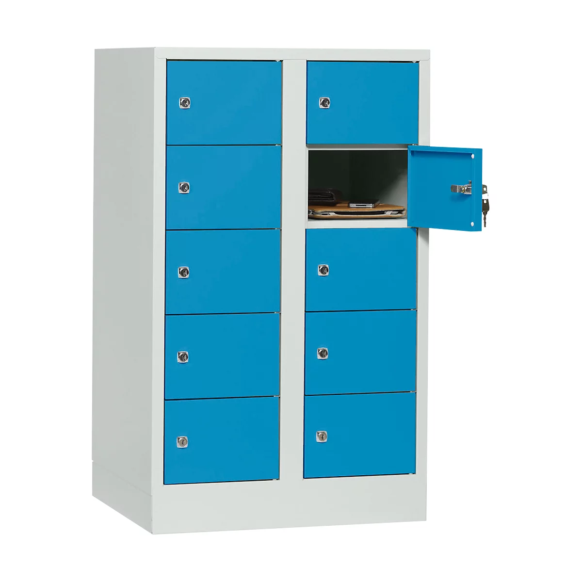 Blue cabinet with multiple compartments, one open. Objects can be seen in the open compartment.