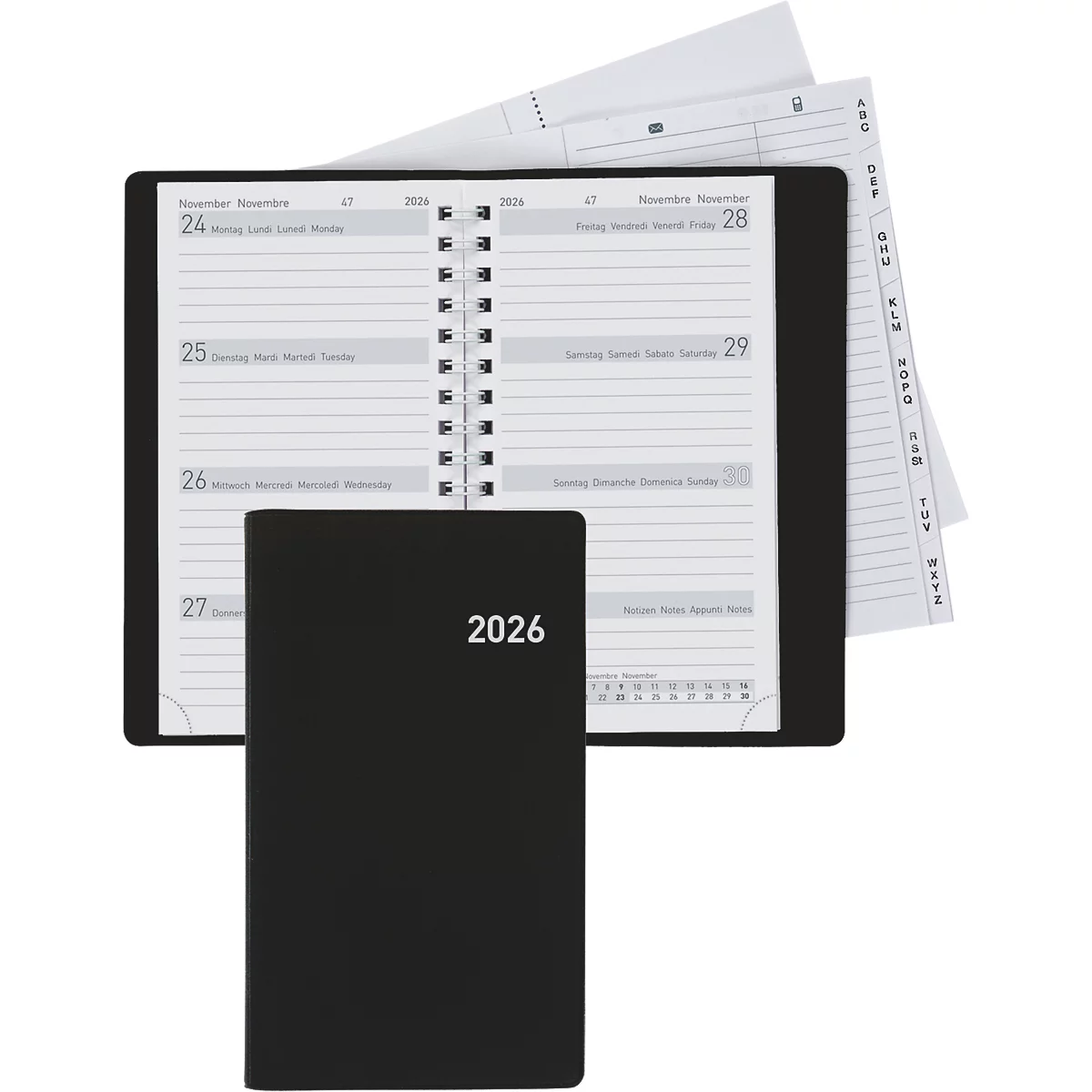 Carnet noir avec l'année 2026. Le carnet est ouvert, montrant une vue hebdomadaire. Un bloc-notes est posé à côté.