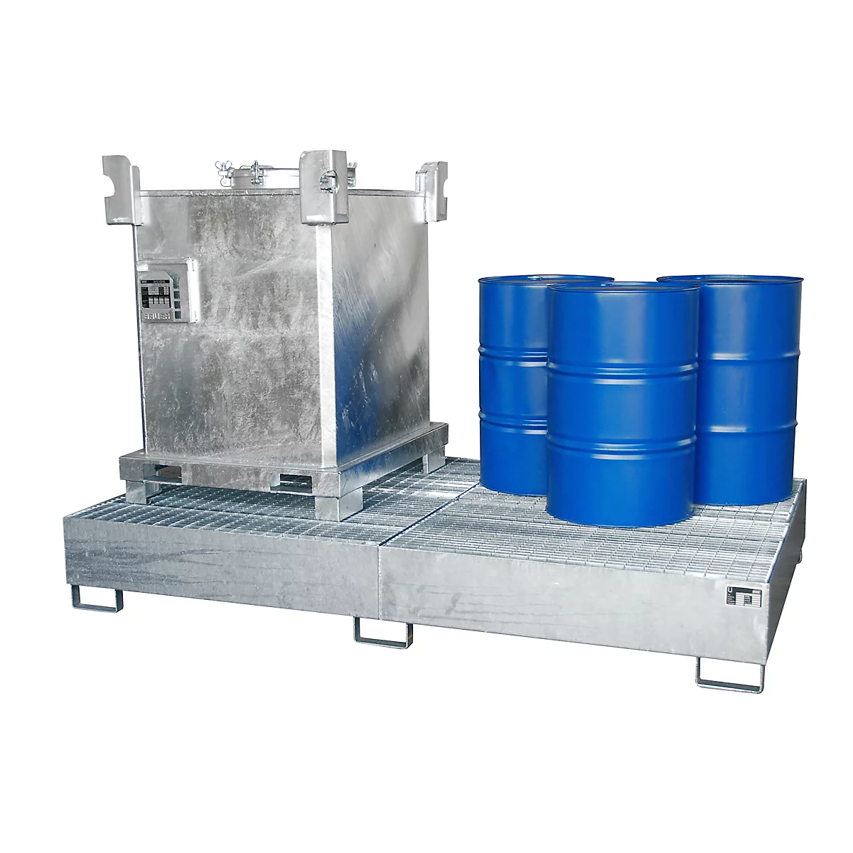 Metal pallet with large container and three blue barrels. The construction looks sturdy.