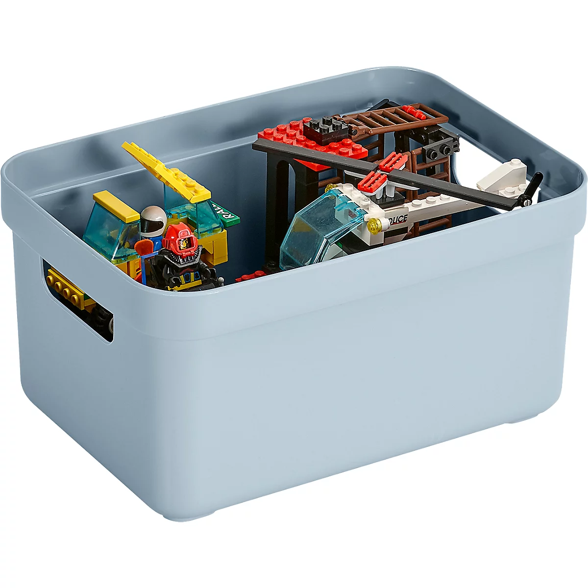 Light blue storage box filled with toys. Inside are Lego bricks, a helicopter and figures.