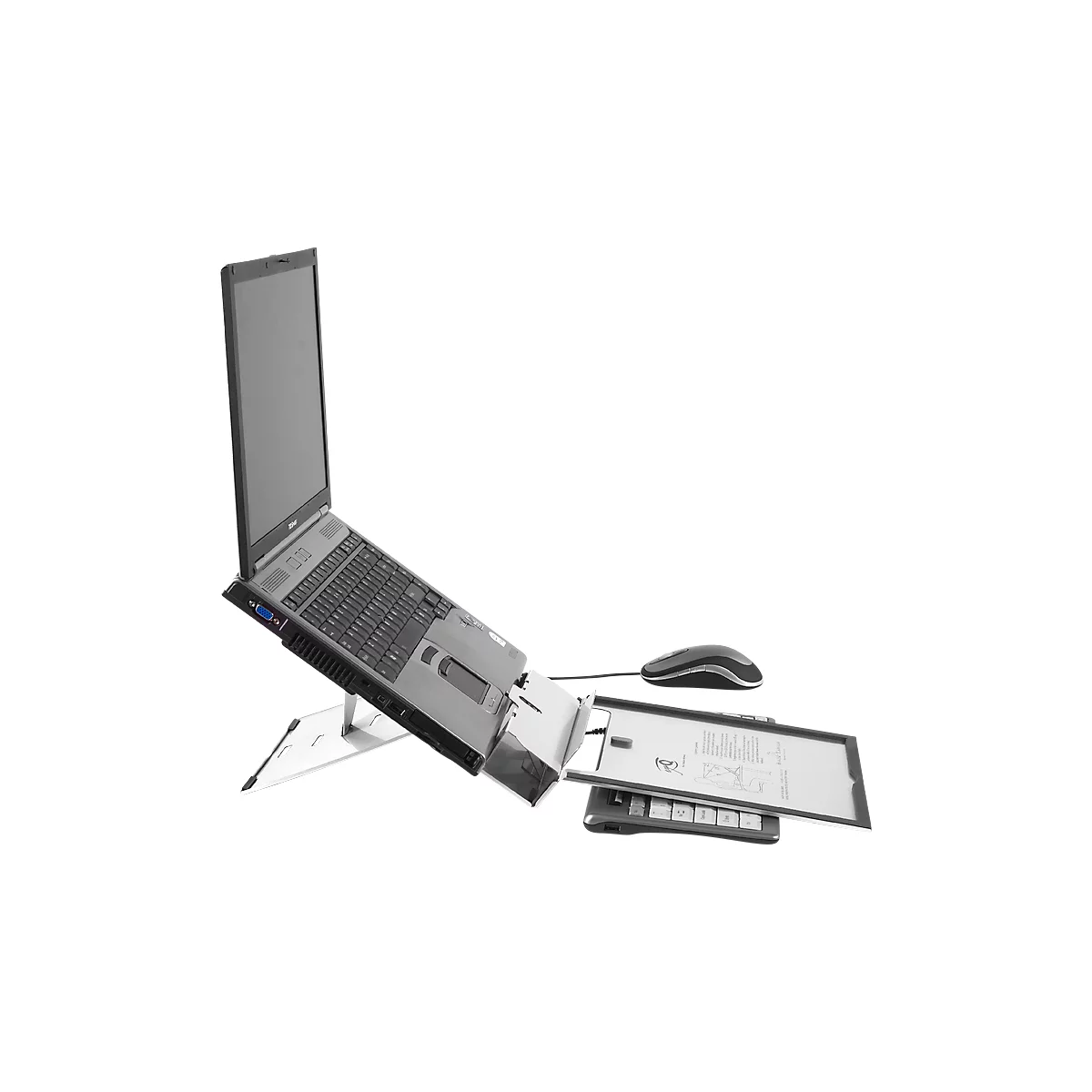 Un ordinateur portable sur un support, avec une souris et un bac à documents.