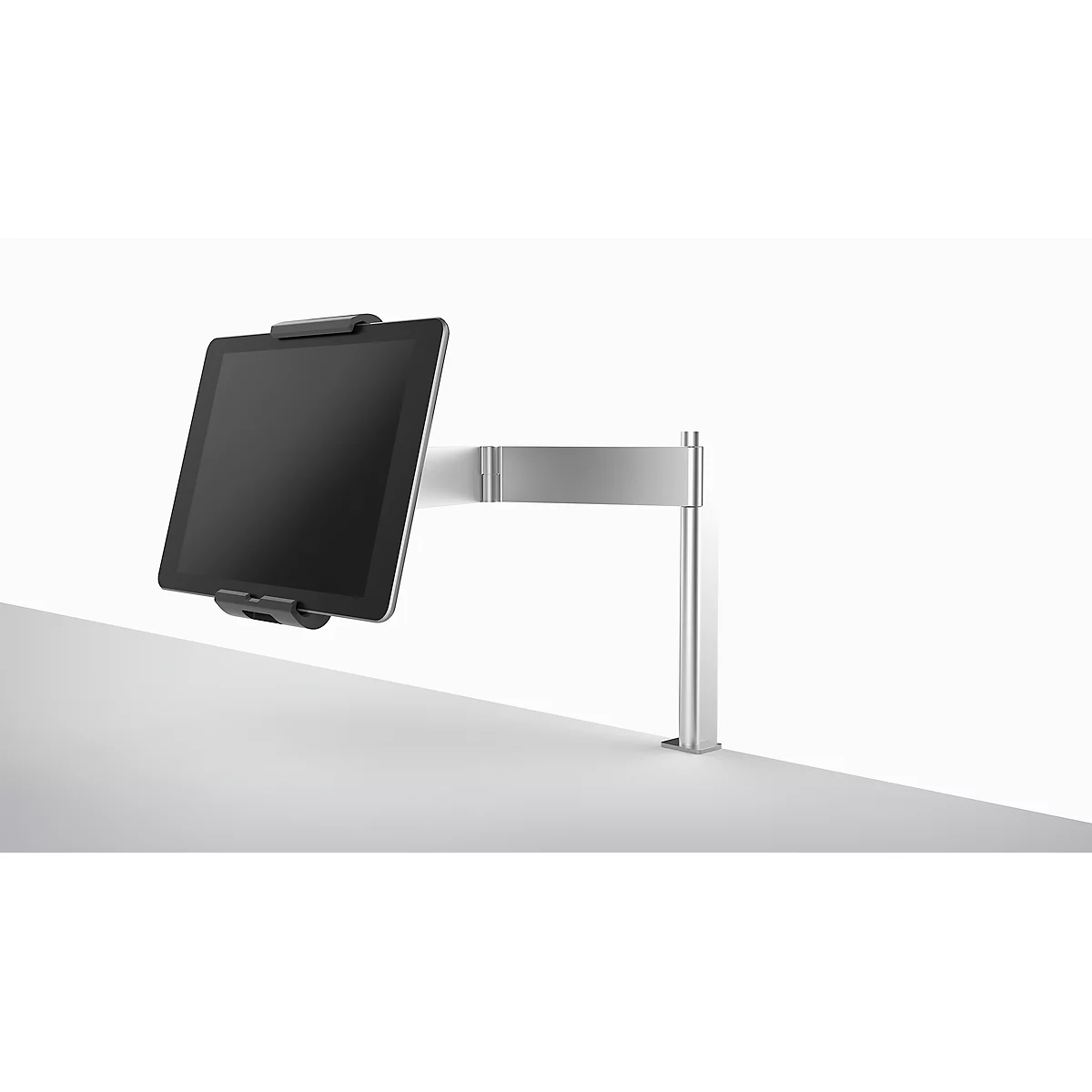 A silver tablet holder with a tablet against a white background. The tablet is black, and the holder is attached to the wall.