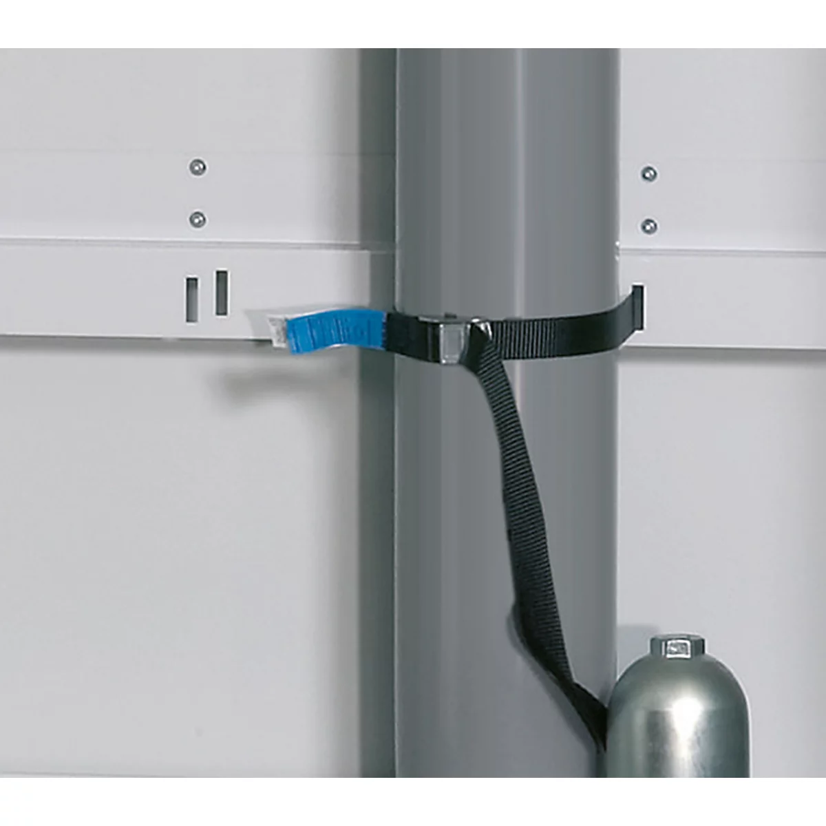 Grey tube secured with black strap. A blue brush is attached to the strap.