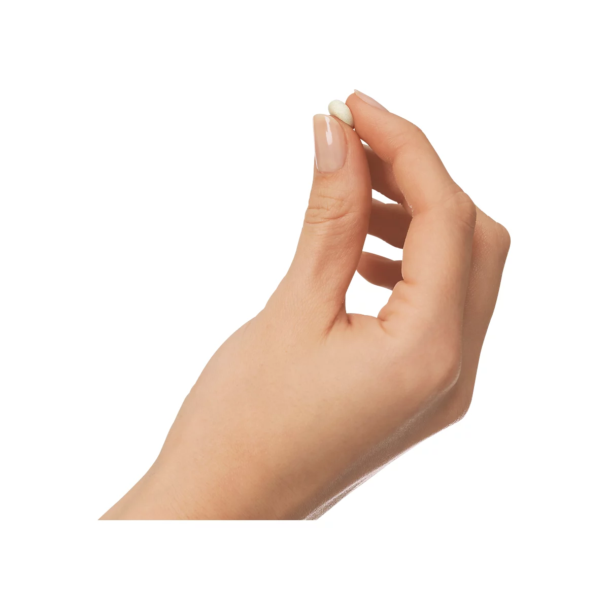 A hand holding a small, oval, cream-colored tablet between thumb and forefinger. Bright background.