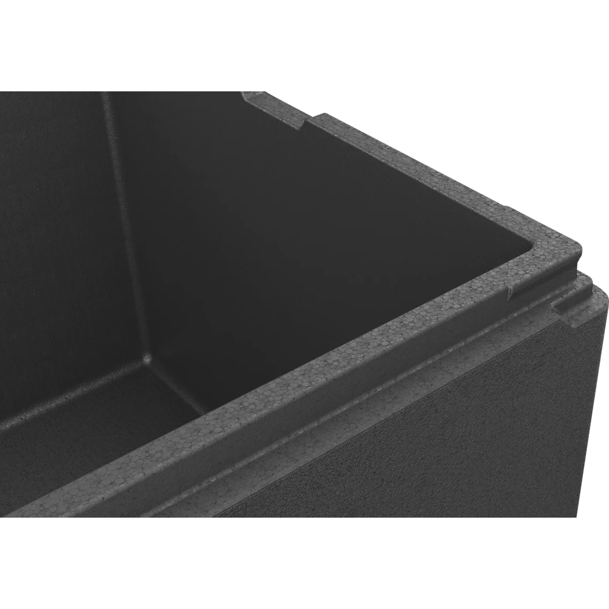 Nahaufnahme der schwarzen Ecke einer EPP-Isolierbox mit strukturierter Oberfläche.