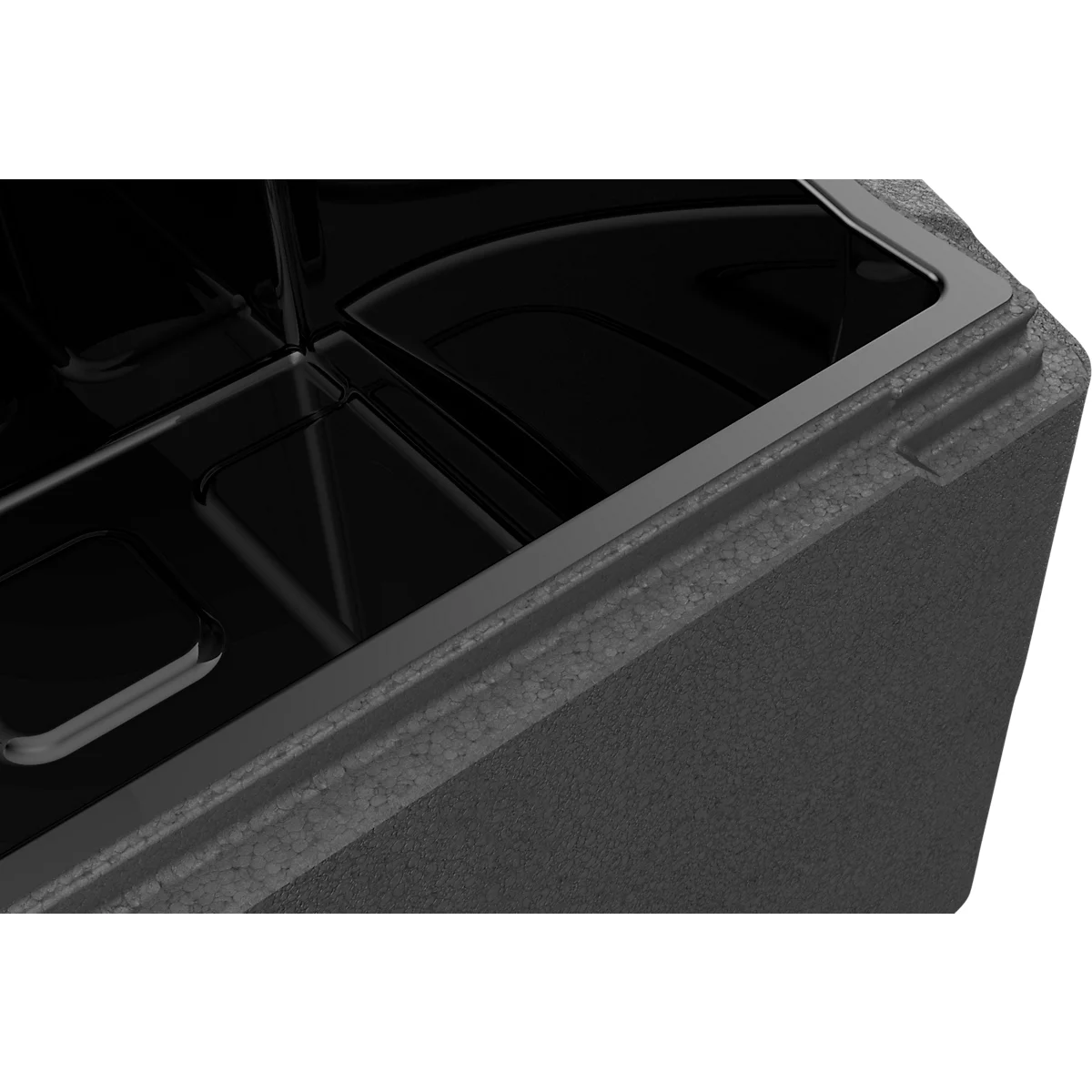 Nahaufnahme einer grauen Styroporbox mit glänzendem schwarzen Innenteil.