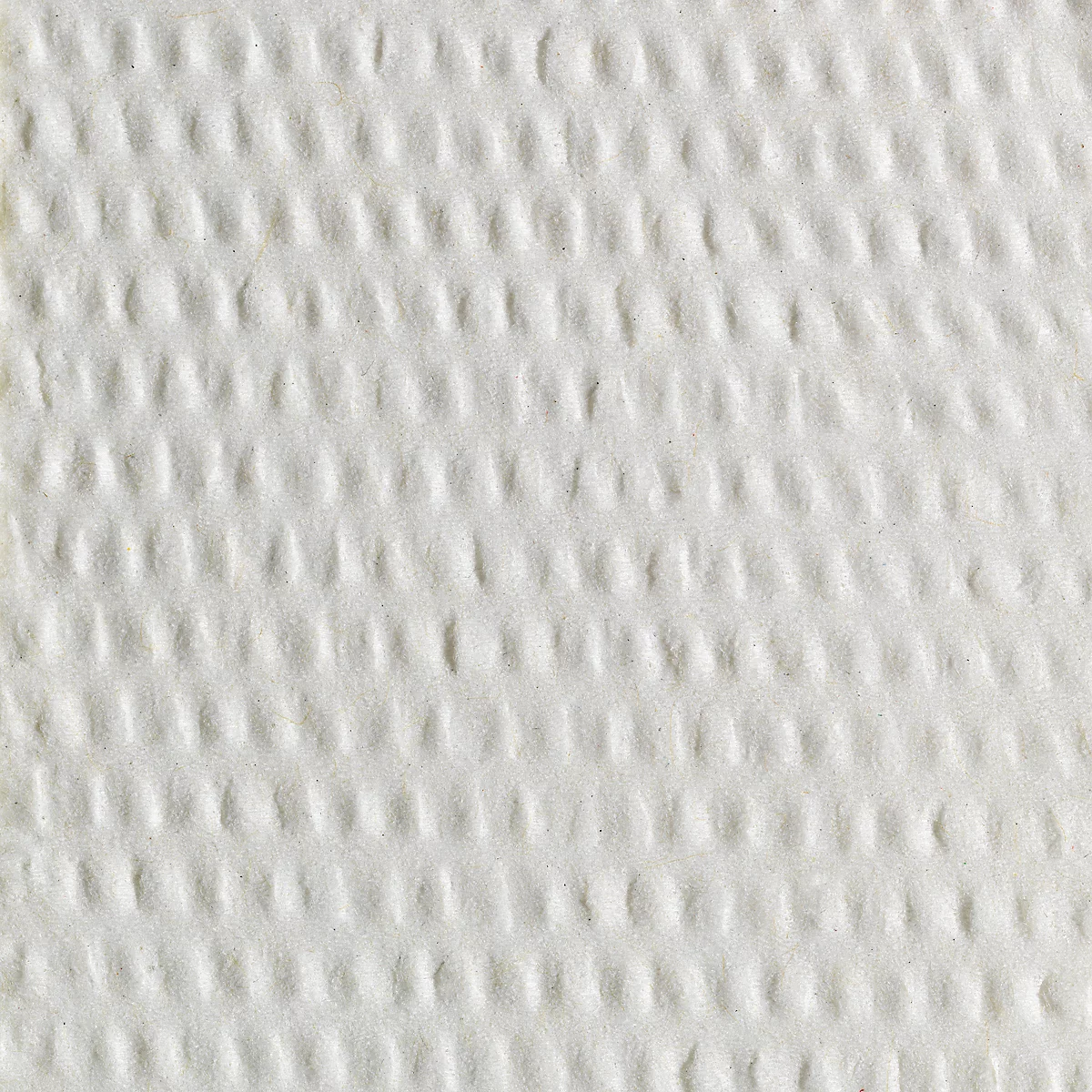 Close-up van wit, getextureerd papier met een regelmatig patroon van verzonken stippen.