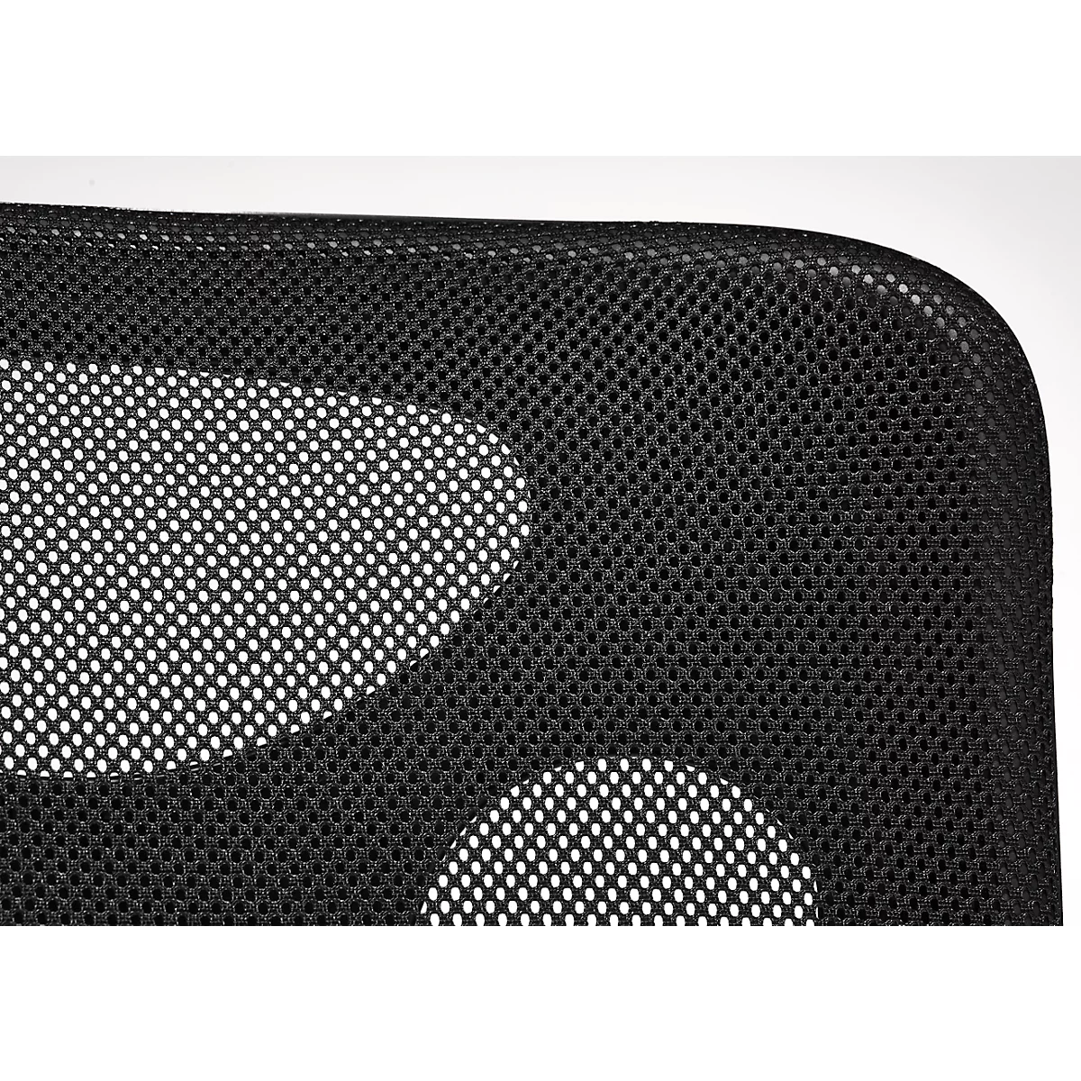 Close-up of a black, honeycomb chair back with white openings.