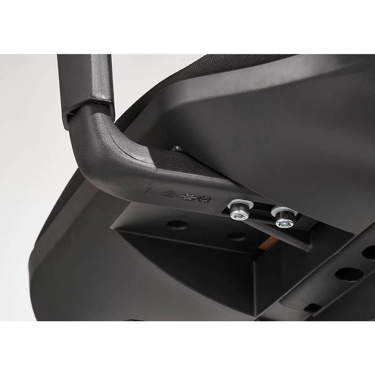 Detailed close-up of a black chair underside with metal fasteners.