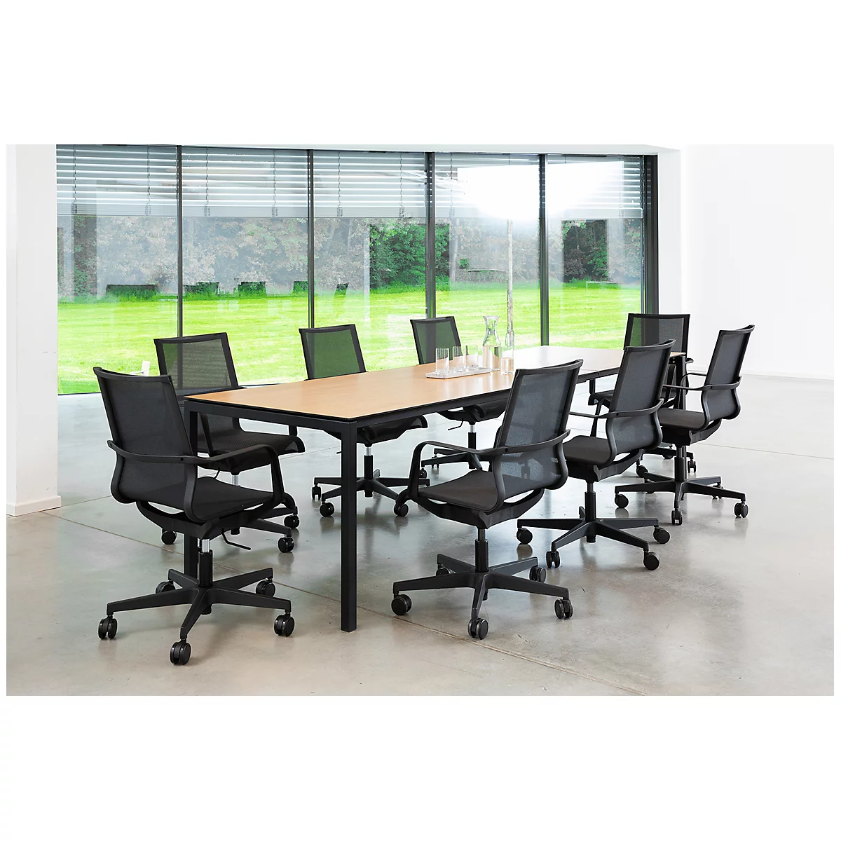 Conference room with large table and chairs in front of panoramic window.