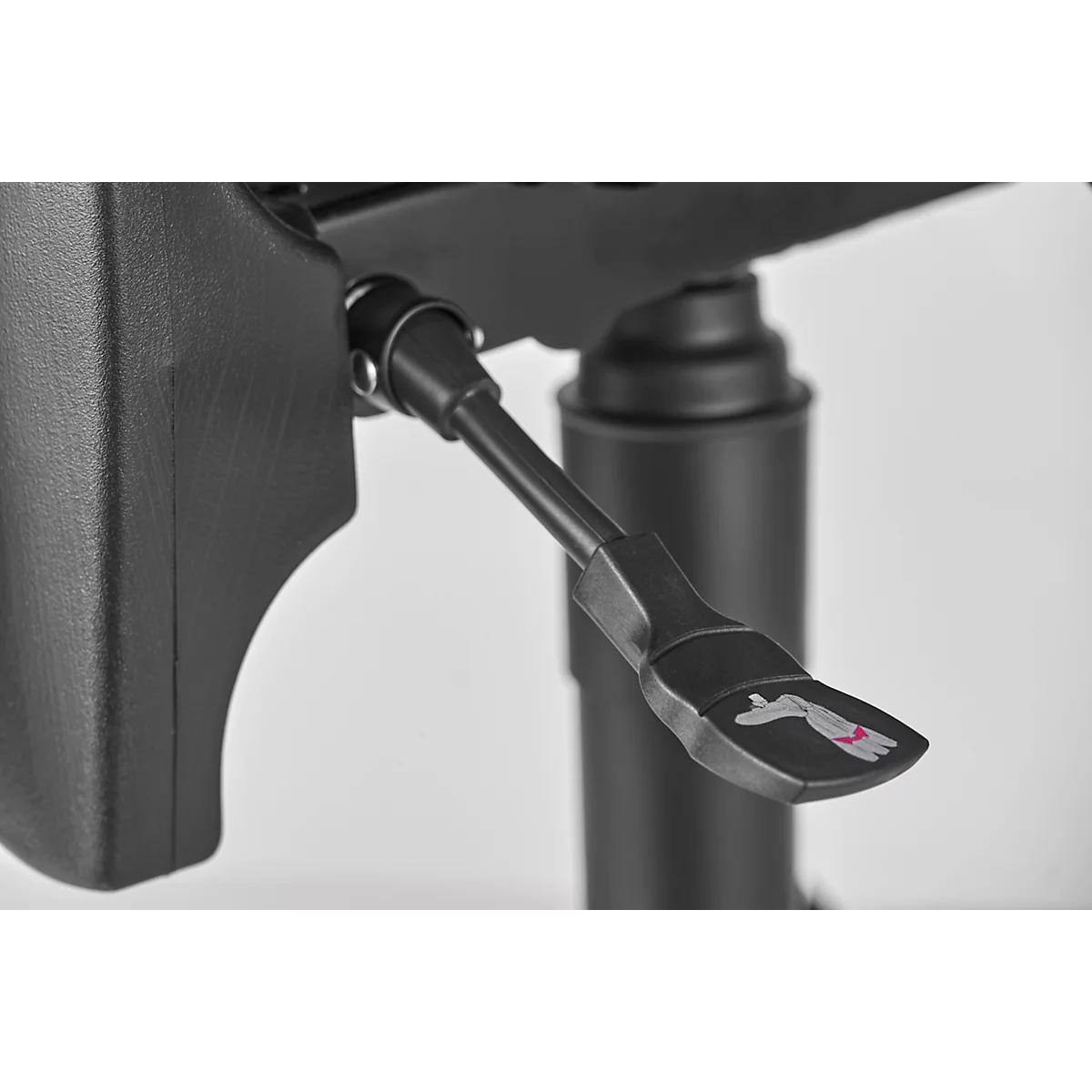 Close-up of a black chair. Lever with hand symbol.