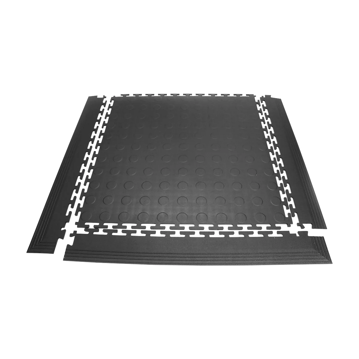 Black rubber floor tiles with white tooth edges forming a rectangle. A few pieces can also be seen on the edge.