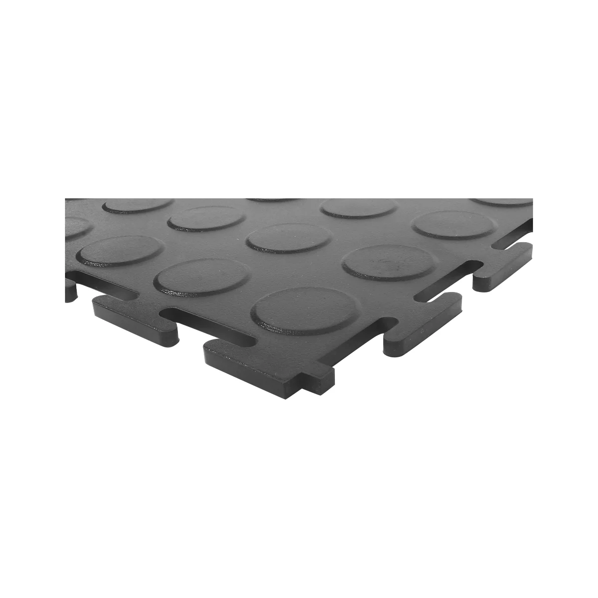 Close-up of a black interlocking rubber floor tile with raised circles.