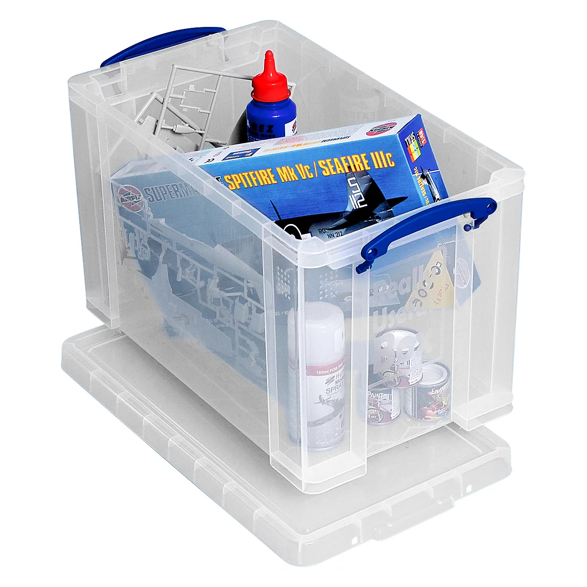 Transparante opbergdoos met hobbybenodigdheden: modelbouwpakket, verf, lijm.