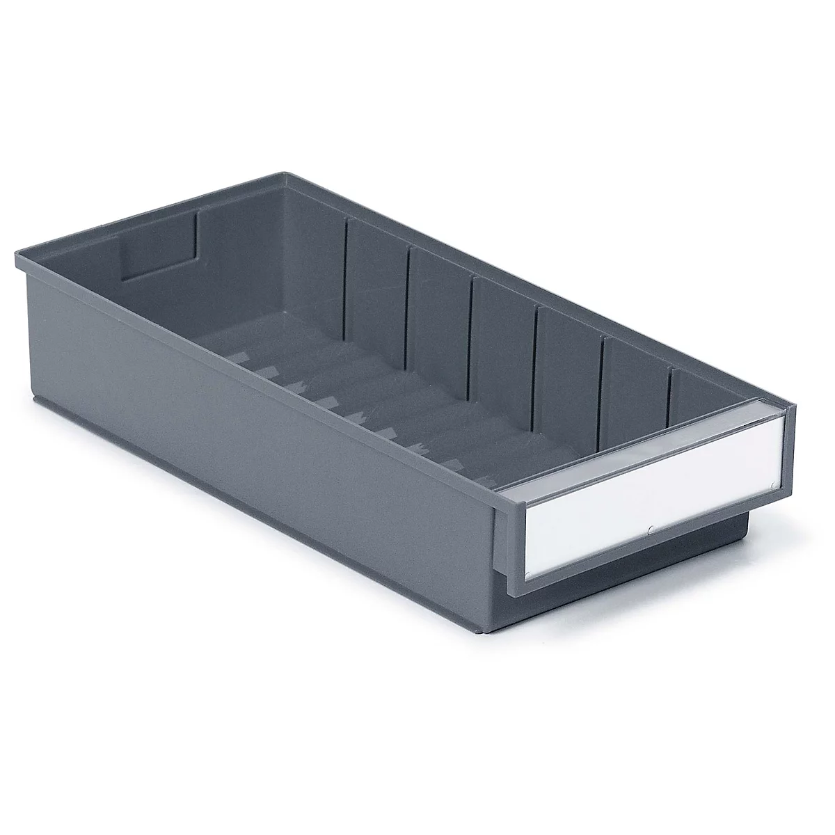 Gray plastic box with compartments. A white label is attached to the front. The picture shows the box slightly diagonally from above.