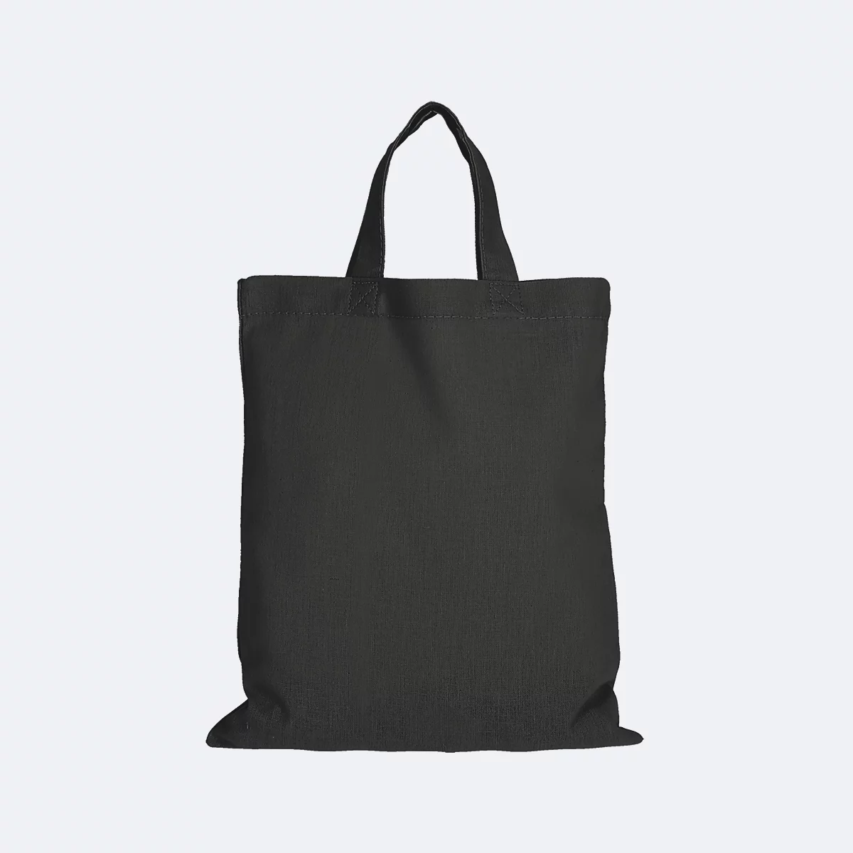 Sac fourre-tout en tissu noir sur fond clair, avec deux anses.