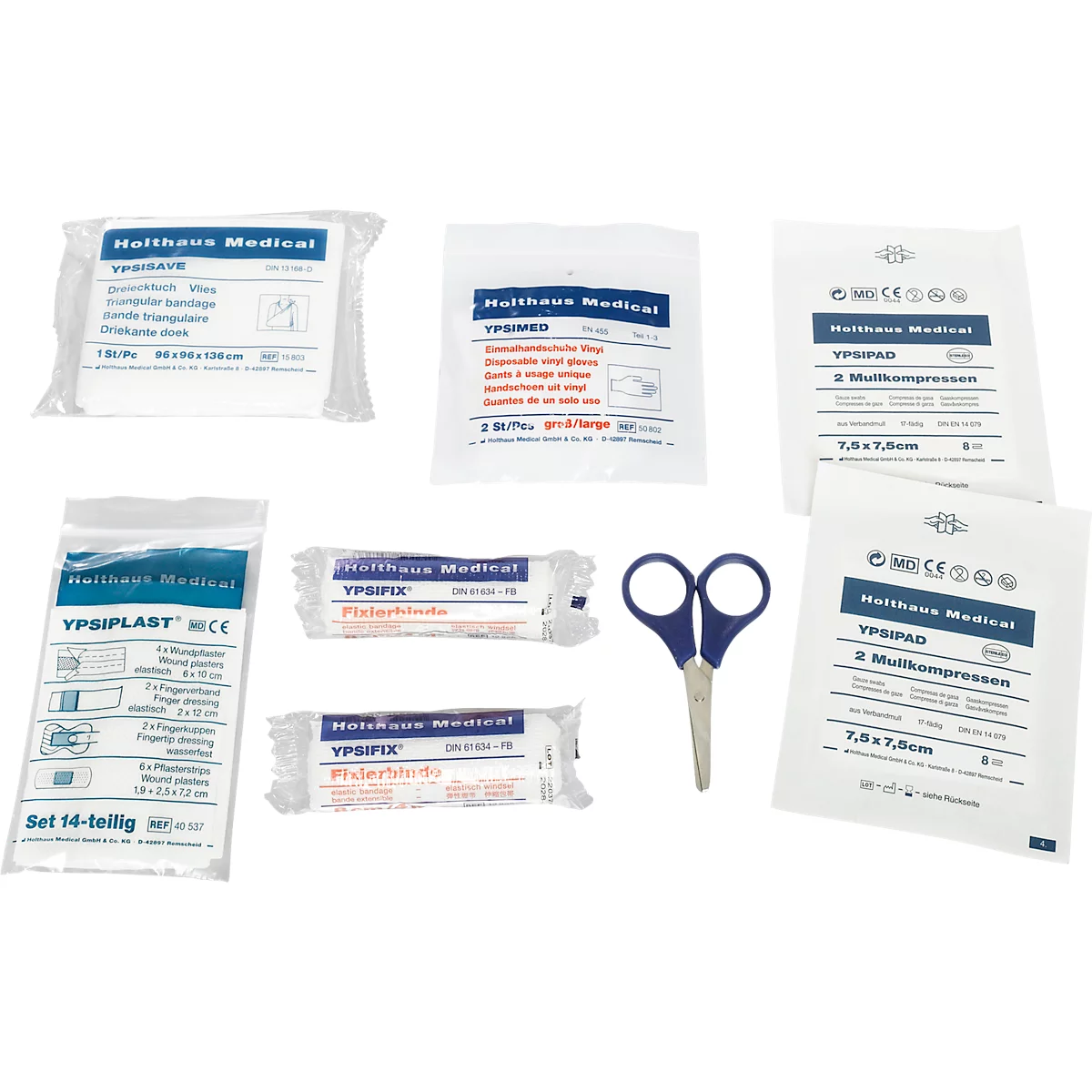 Contenu d'une trousse de premiers secours sur fond blanc. Comprenant des bandages de gaze, des pansements, des compresses et des ciseaux. Imprimé : "Halthaus Medical".