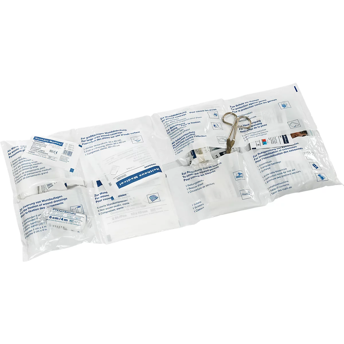 Instruments médicaux dans des emballages transparents individuels. Une pince est posée en vrac sur les emballages.