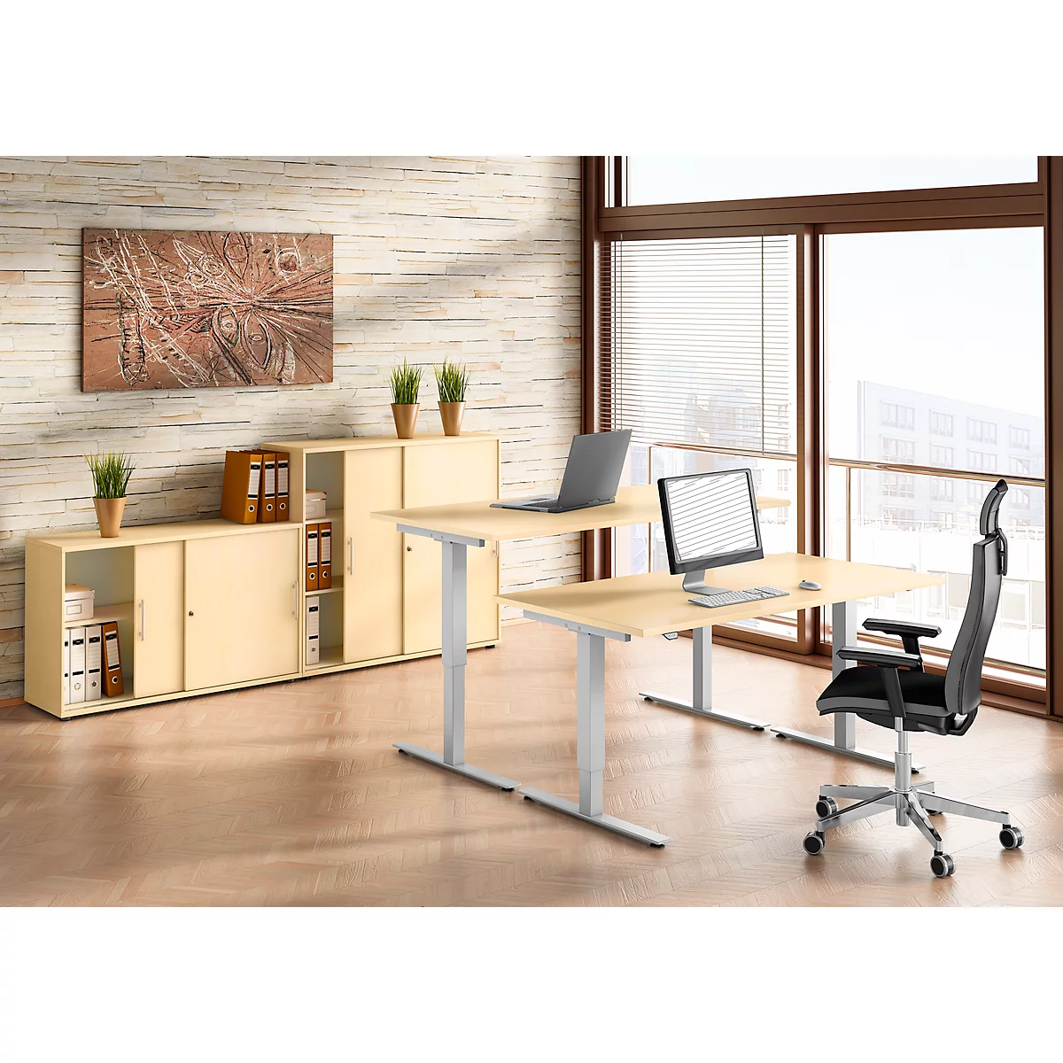 Office with desks, cabinet, and chair. Windows in the background.