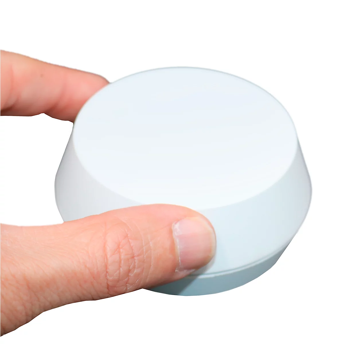 Wit, rond apparaat in een hand gehouden.