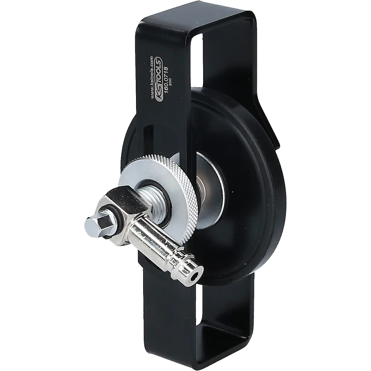 Schwarzes Werkzeug mit einem runden, schwarzen Element und silbernen Schrauben und einem Knarrenschlüssel.