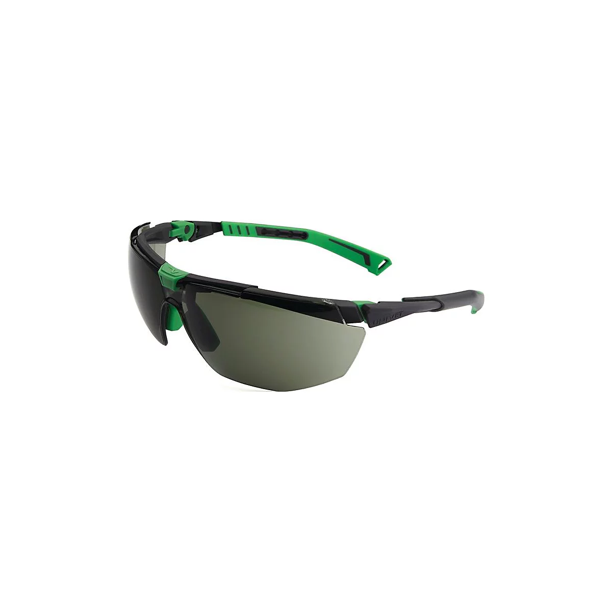 Lunettes de protection avec monture noire et accents verts. Les verres sont teintés en gris. Les lunettes sont en diagonale dans l'image.