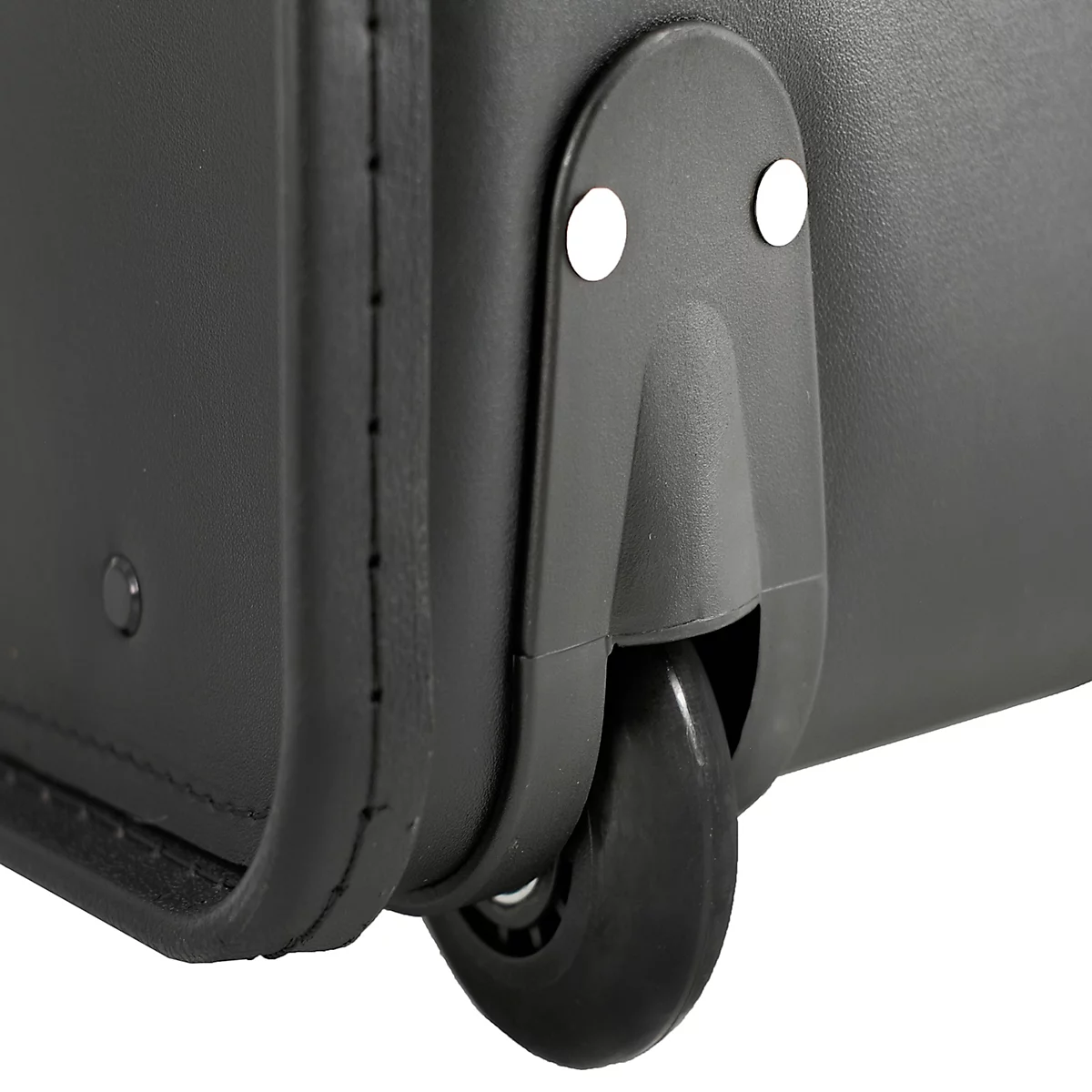 Gros plan sur une roue de valise noire avec support et deux rivets blancs.