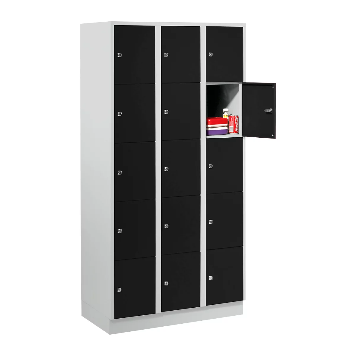 Cabinet with multiple compartments, one door open with contents. Black and white.