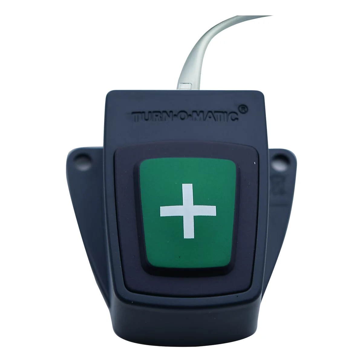 Donkergrijs apparaat met groene knop met wit plusteken. Er staat 'TURN-O-MATIC'. Er gaat een kabel weg.