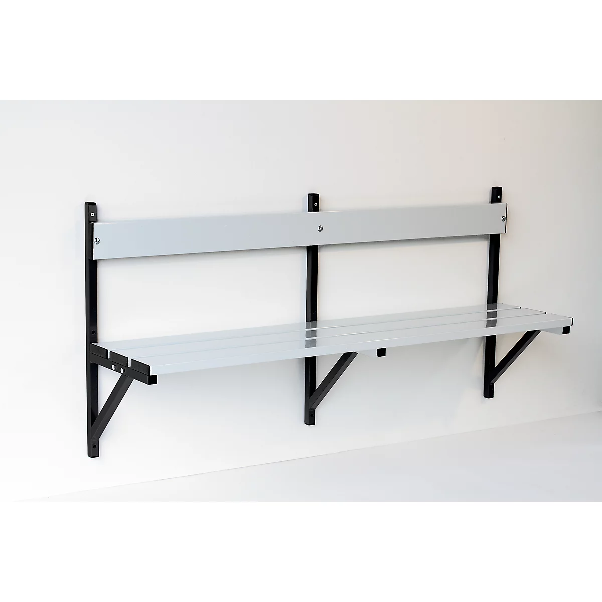 Gray wall bench with backrest, black mount. Mounted on the white wall.