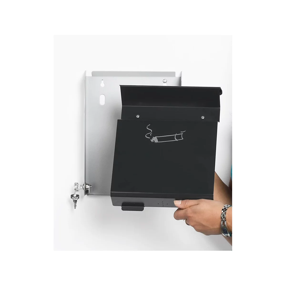 Black ashtray mounted on a wall. Sign with a cigarette and smoke. Someone is holding up the lid.