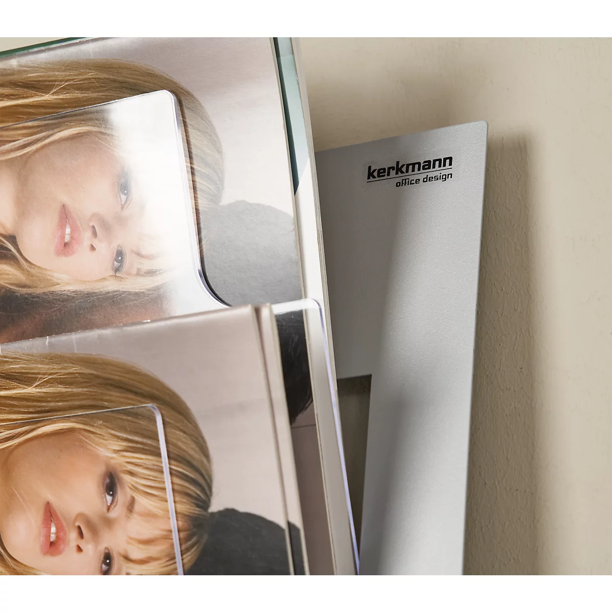 Magazine holder with two magazines. On a white paper it says: kerkmann office design.