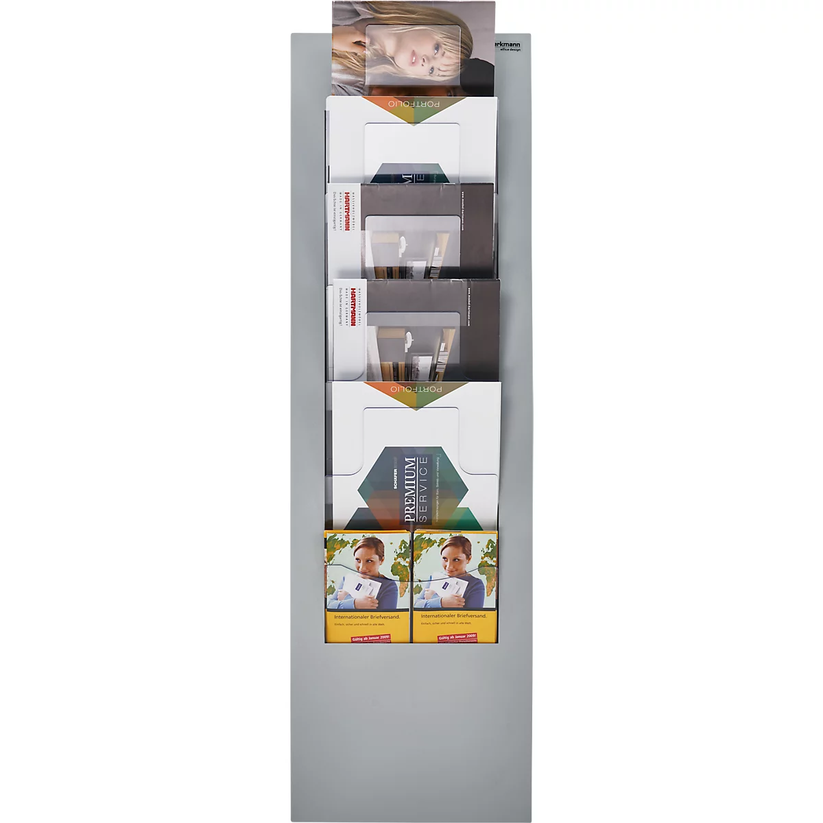 A gray brochure rack with several brochures displaying various designs.