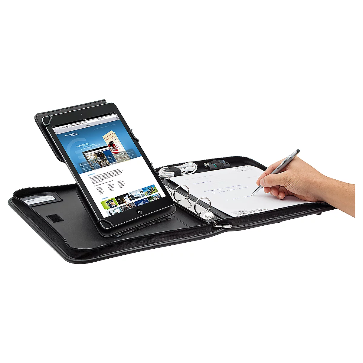 Black tablet case with pen holder, notepad and hand writing with a pen. A tablet with an open website is held.