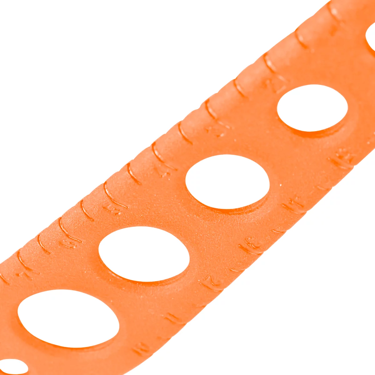 Orange plastic strip with oval holes. Small markings are visible on the edge.