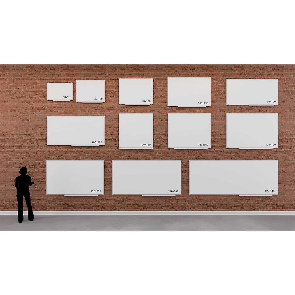 Verschillende witte fotolijsten met maatspecificaties op een bakstenen muur. Een silhouet van een persoon staat ervoor.