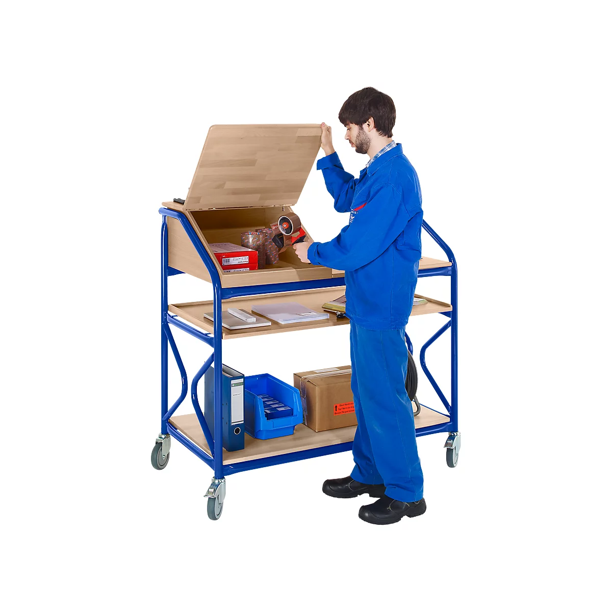A man in blue overalls opens a serving cart. There are tools and accessories on the cart.