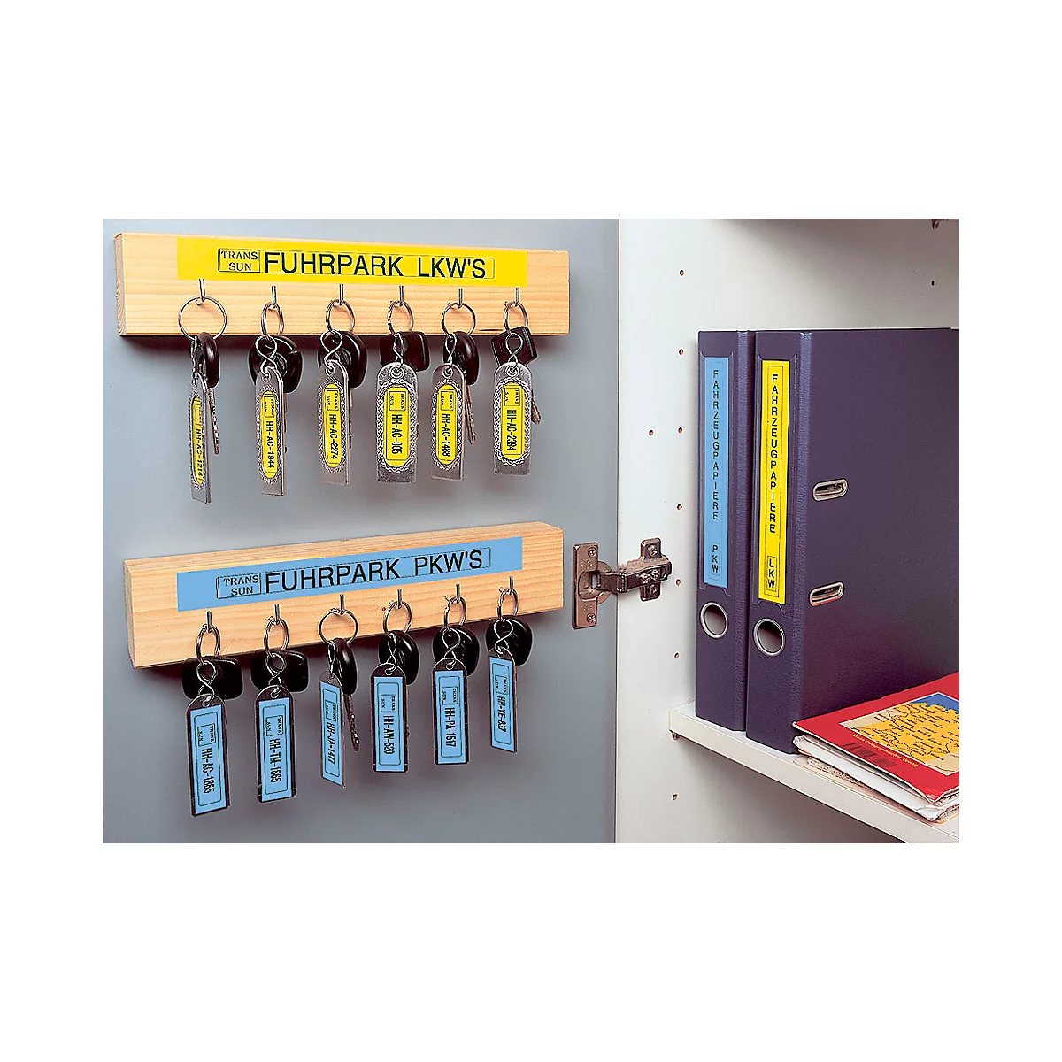 Key rack with keys for trucks and cars, next to folders in the closet.