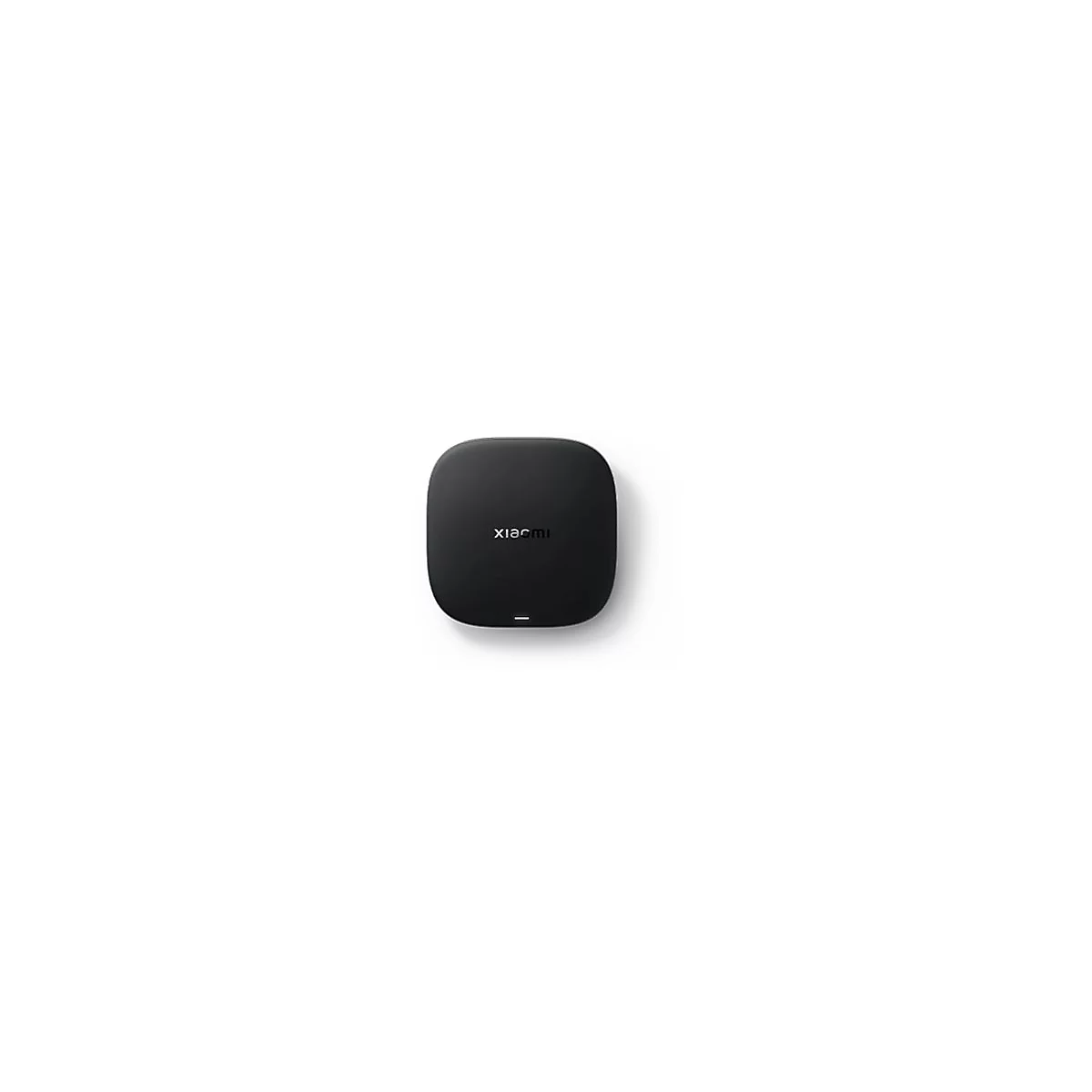 Schwarze, quadratische Xiaomi TV-Box mit abgerundeten Ecken und einer kleinen Status-LED auf weißem Hintergrund.