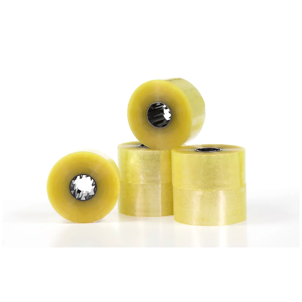 Yellowish adhesive tapes on a white background. Several rolls stacked overlapping.